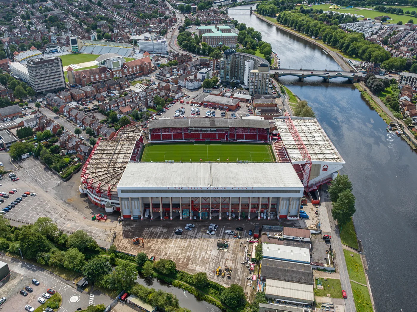 The City Ground from the air in 2023, with the Brian Clough Stand in the foreground and the Peter Taylor Stand along the river