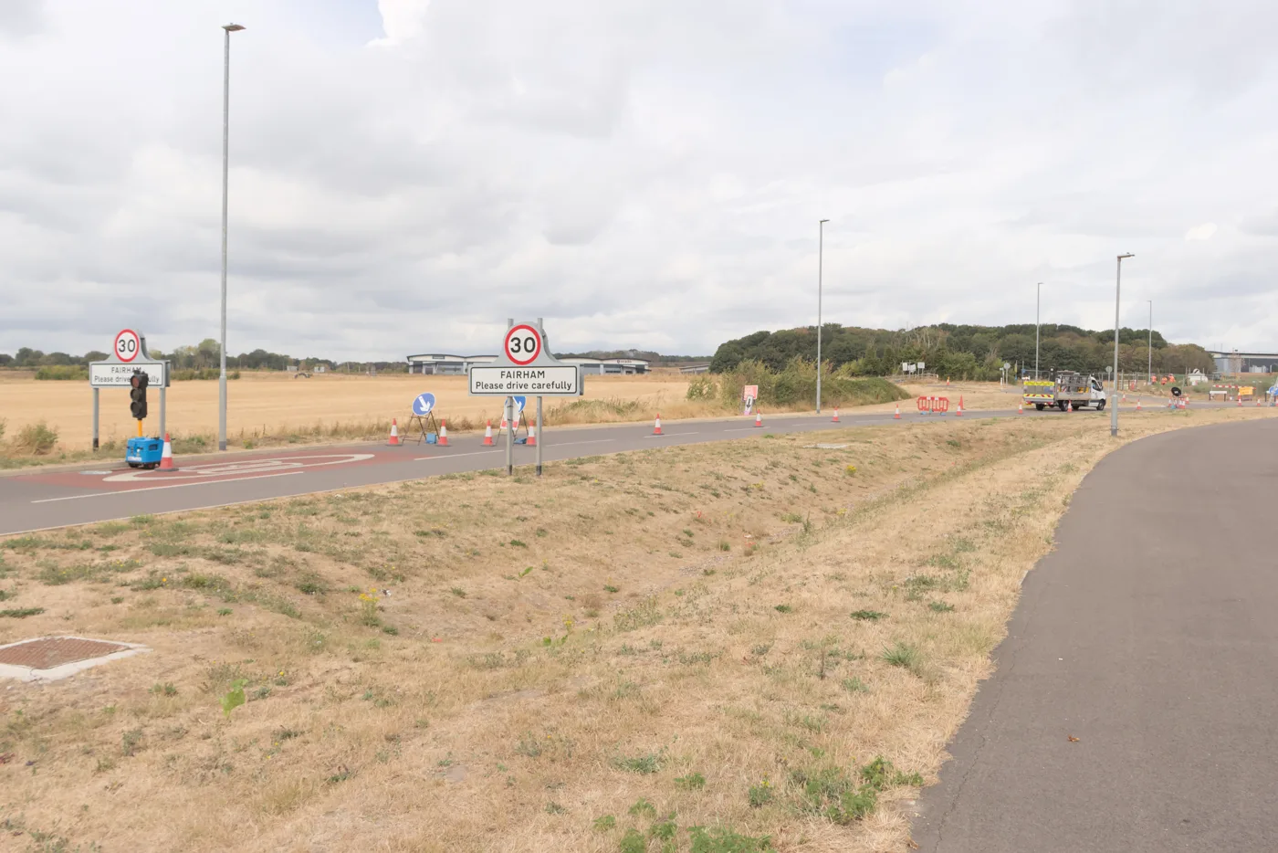 The Fairham sign on Nottingham Road, with open land beyond