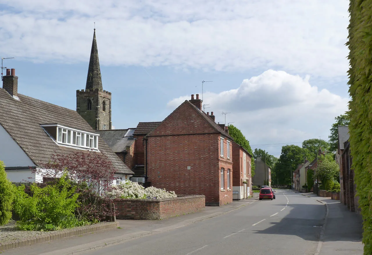 Main Street, Sutton Bonington, with the tower of St Michael's church. The church is one of the 66's stops in the village.